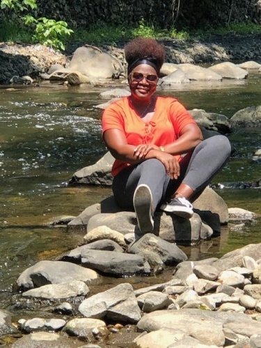 Taking in the serene flow of the water